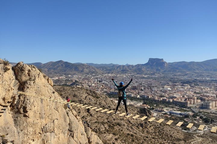 a man standing on a rocky hill