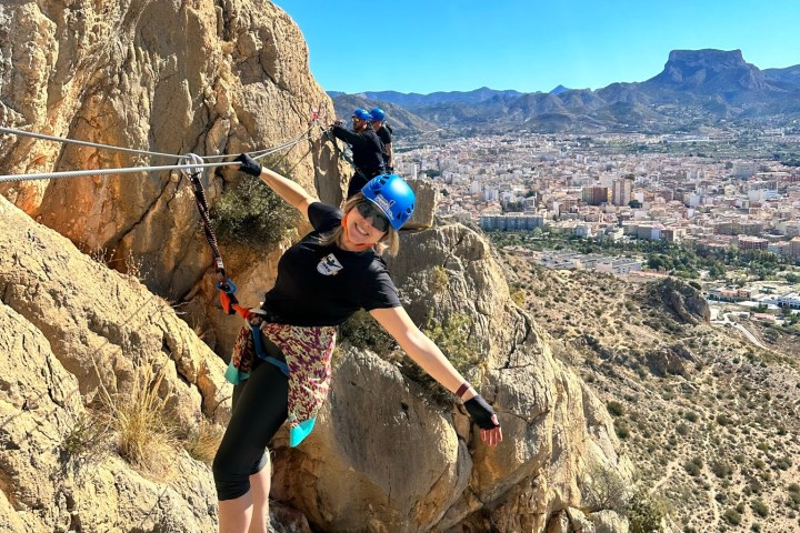 a man standing on a rocky hill