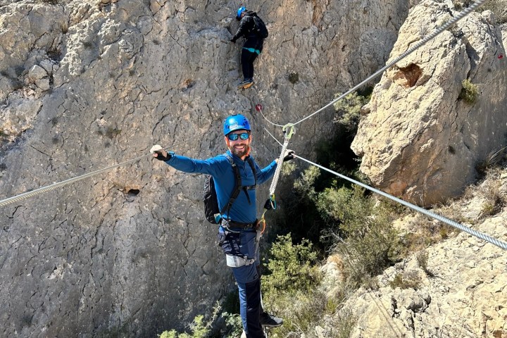 a man standing on a rocky hill