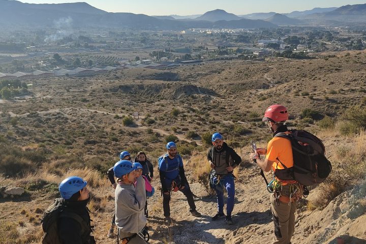 a group of people standing on top of a mountain