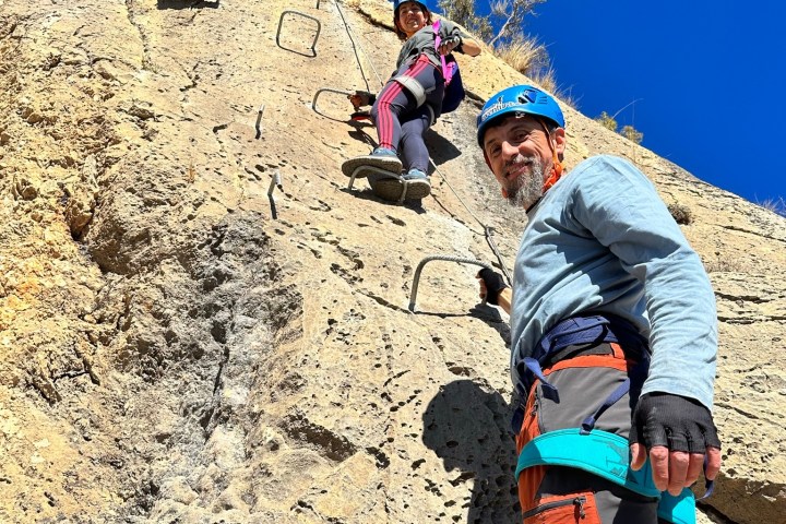 a person standing on a rocky hill