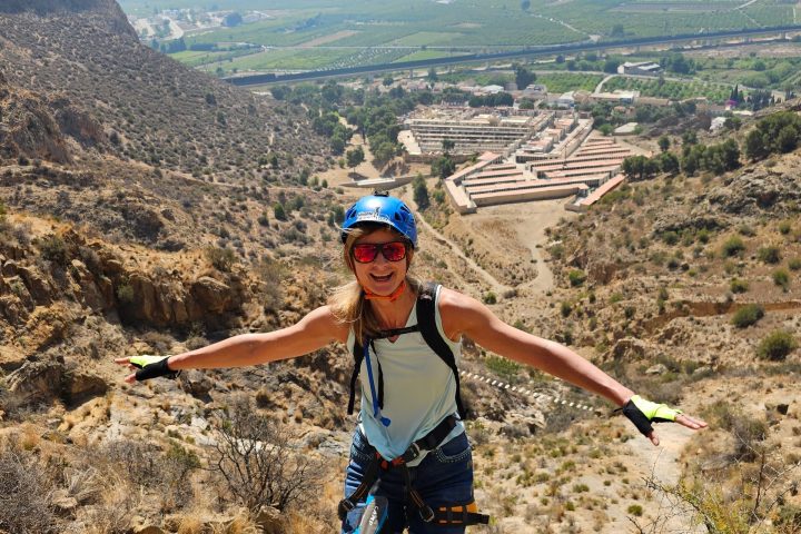 a man standing on a rocky hill