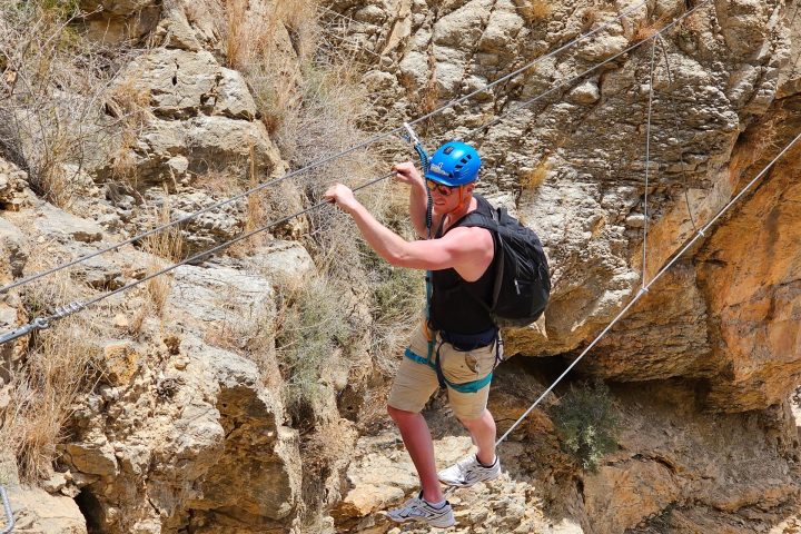 a man riding on top of a rock