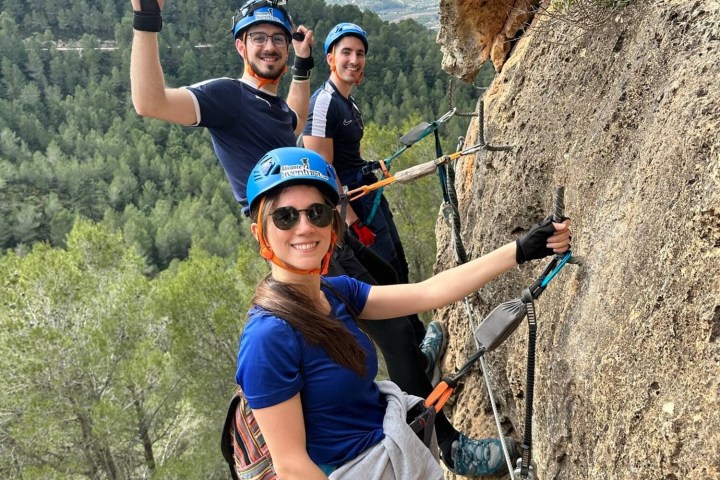 a man riding a bike down a dirt road