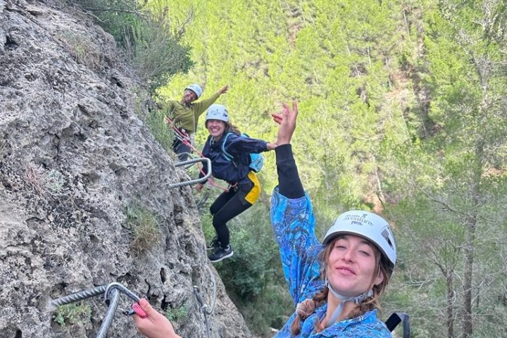 a boy standing in front of a mountain