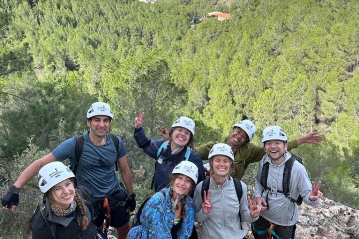 a group of people standing on top of a mountain