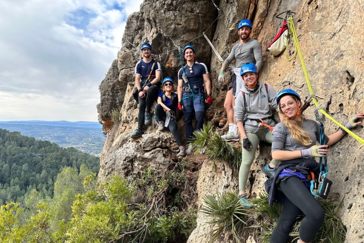 a group of people on a rocky hill