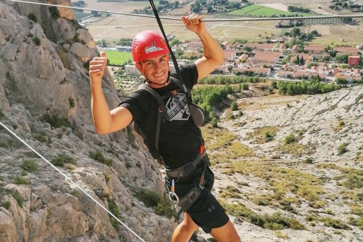 a man standing on a rocky hill