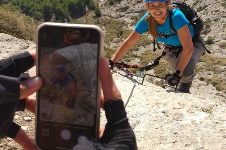 a group of people standing on top of a mountain