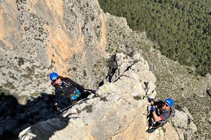 a group of people on a rocky hill