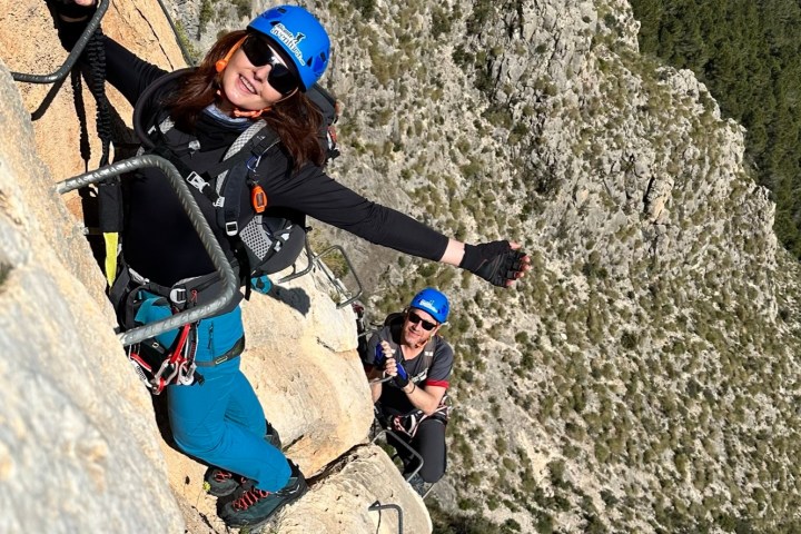 a man standing on a rocky hill