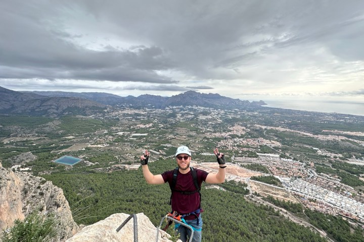 a man standing on a rocky hill