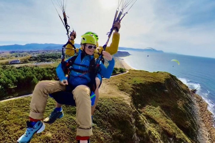 a man holding a parachute