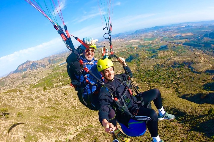a person sitting on top of a mountain