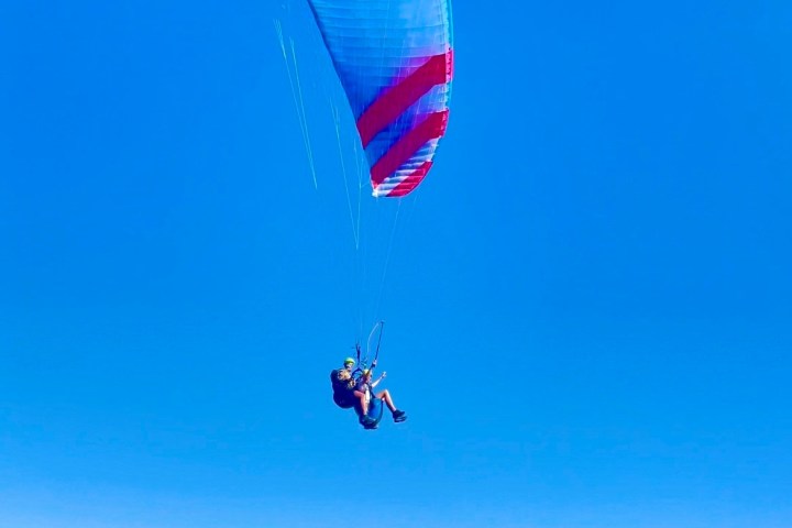 a person flying a kite in the air