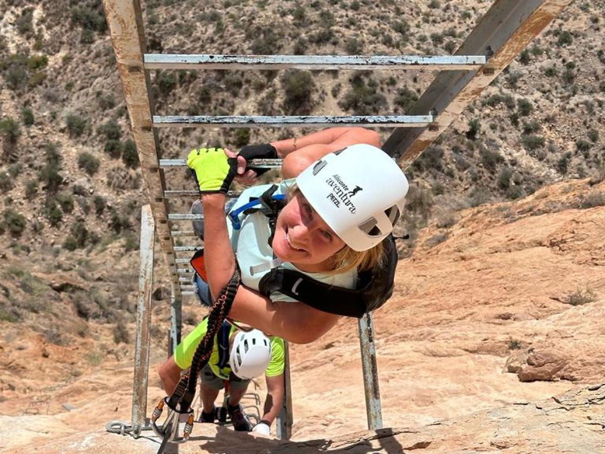 a man riding a bike down a dirt road