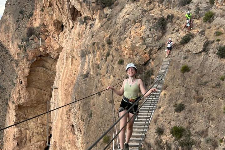 a group of people on a rock