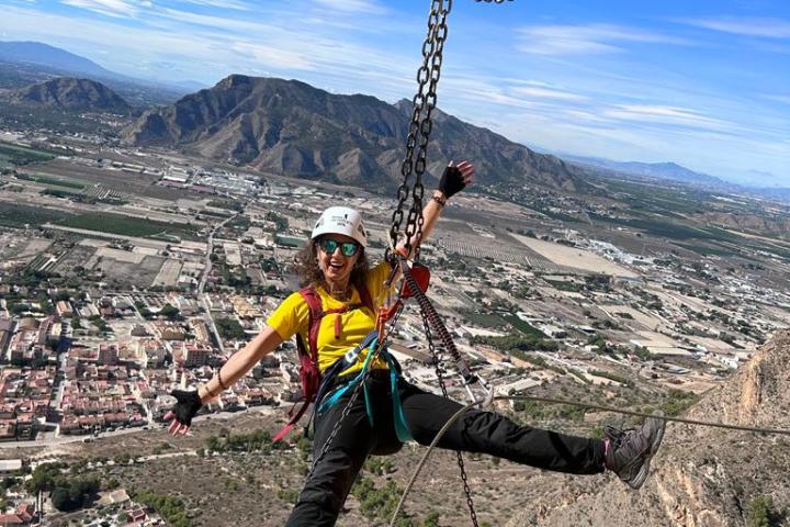 a man standing on a rocky hill
