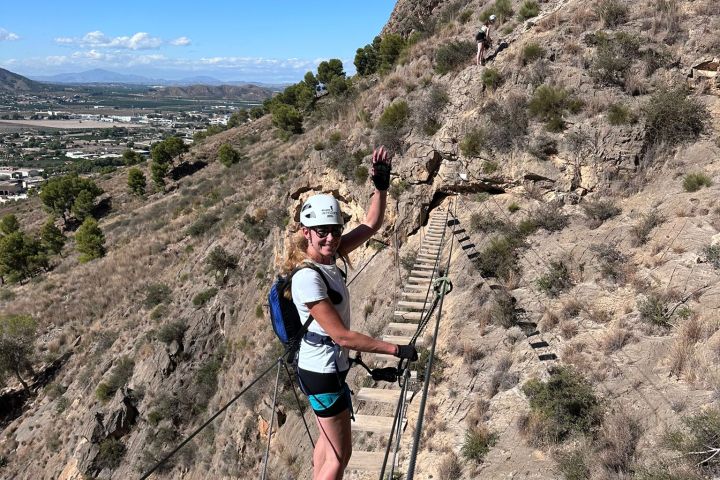 a man standing on a rocky hill