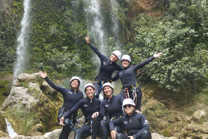 a group of people on a rock