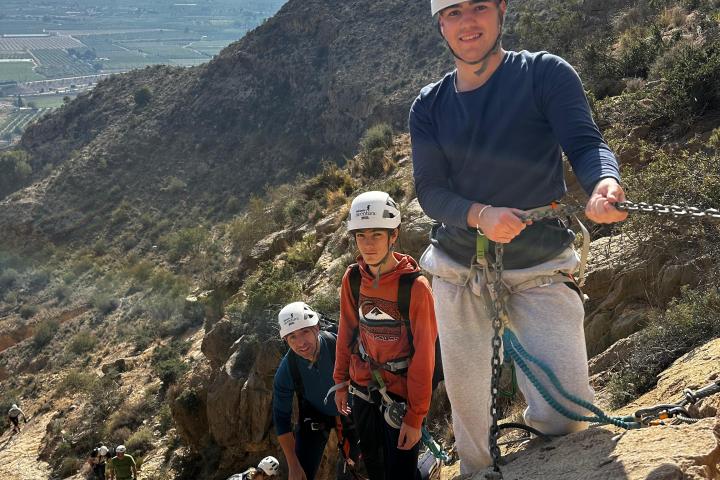 a man standing on a rocky hill