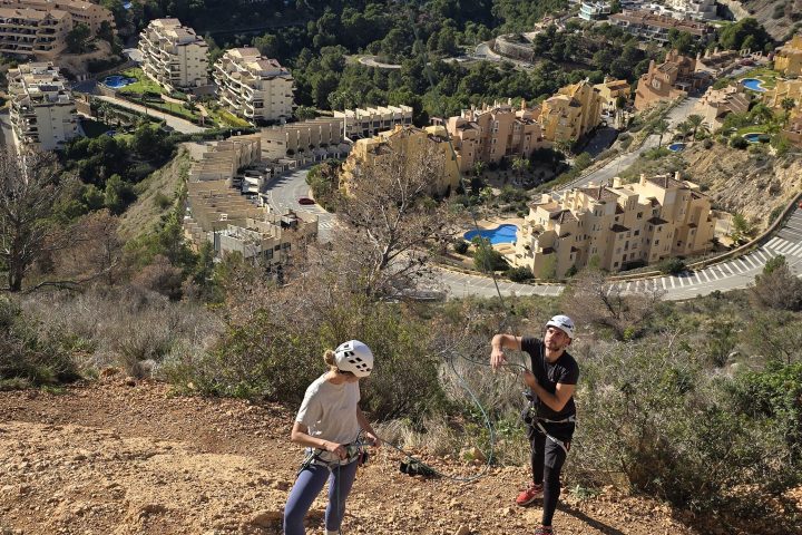 a group of people on a rocky hill