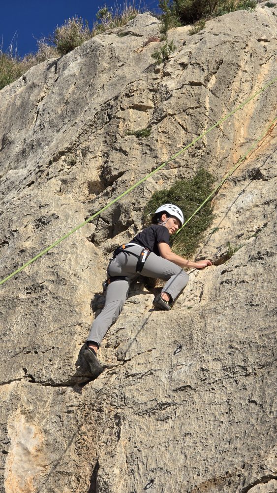 a man riding on top of a rock