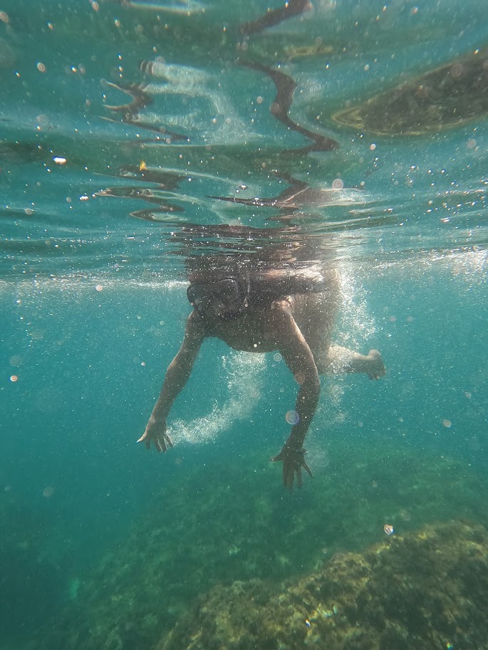 a person riding a wave on a surfboard in the water