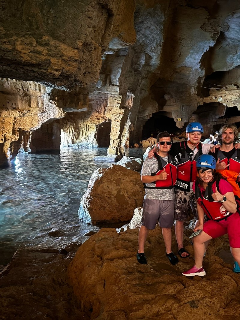 a group of people on a cave