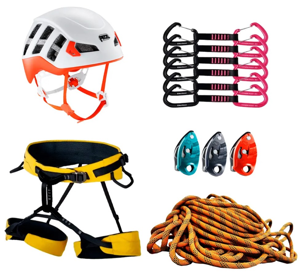 Assorted climbing gear: helmet, carabiners, harness, belay devices, and rope.