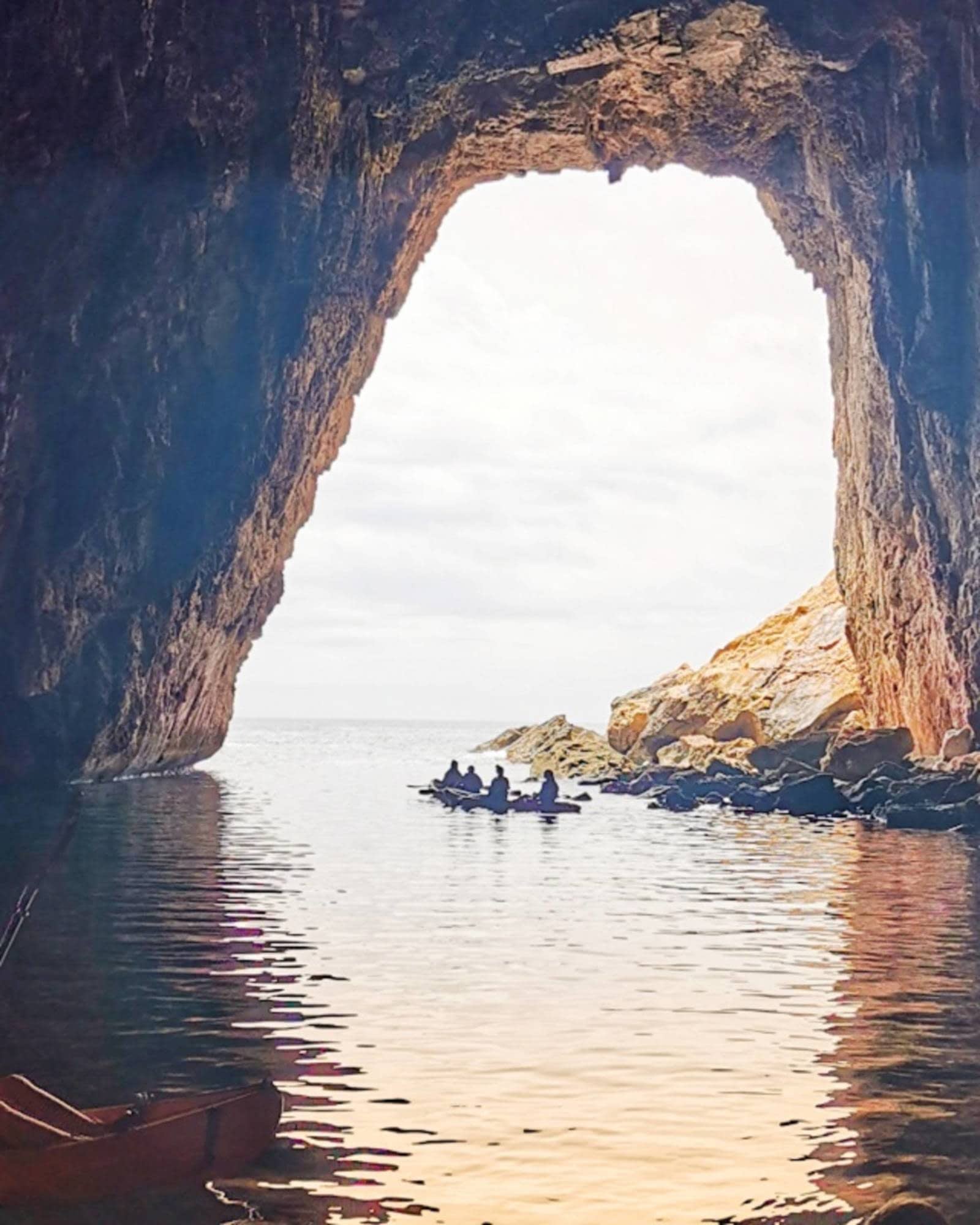 a body of water with a mountain in the background