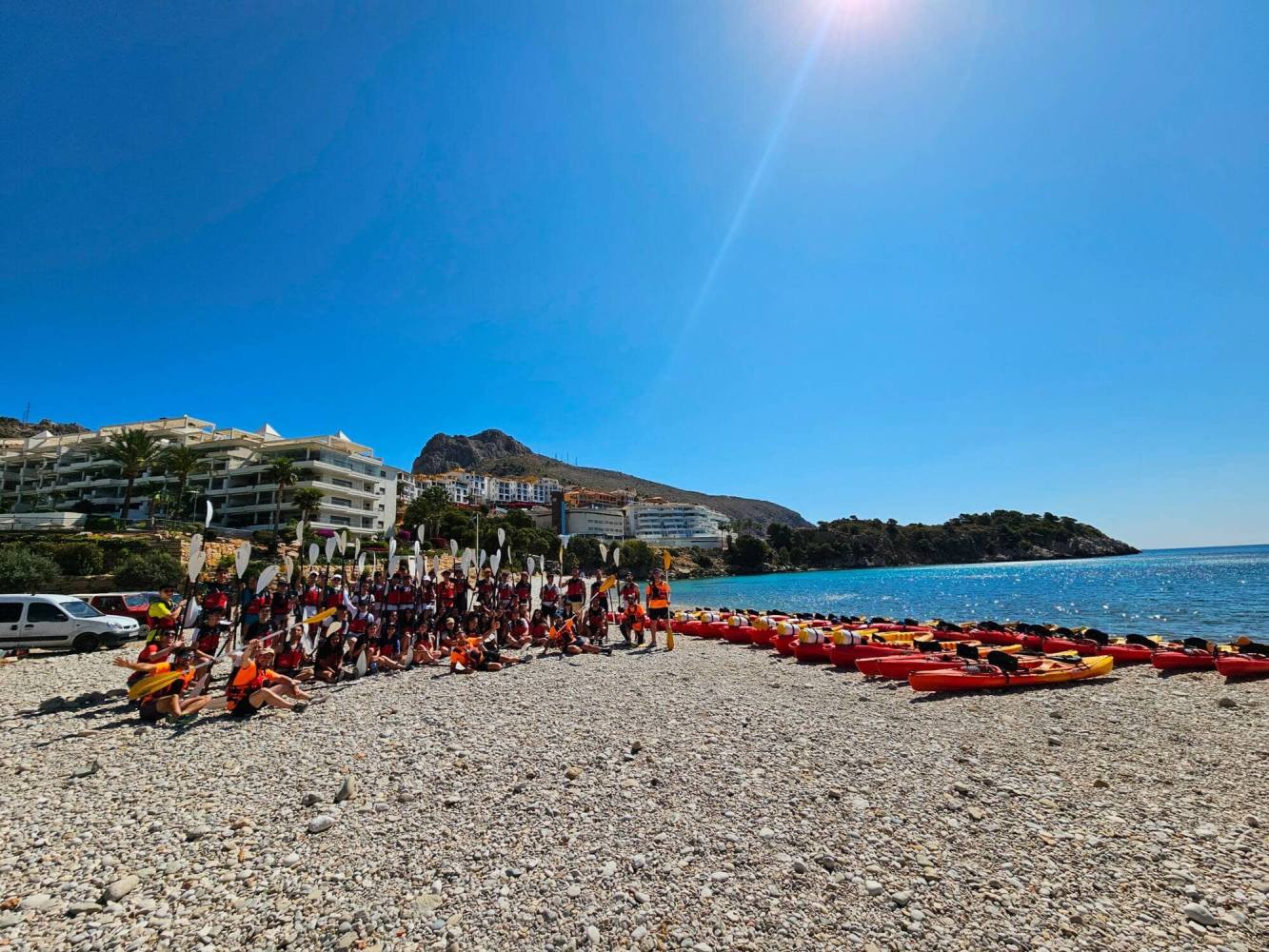 a group of people on a beach