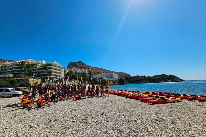 a group of people on a beach