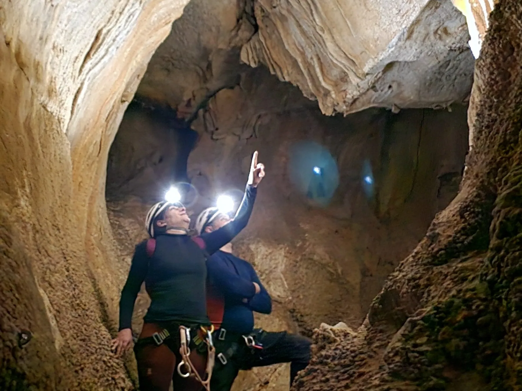 a person riding on the back of a cave
