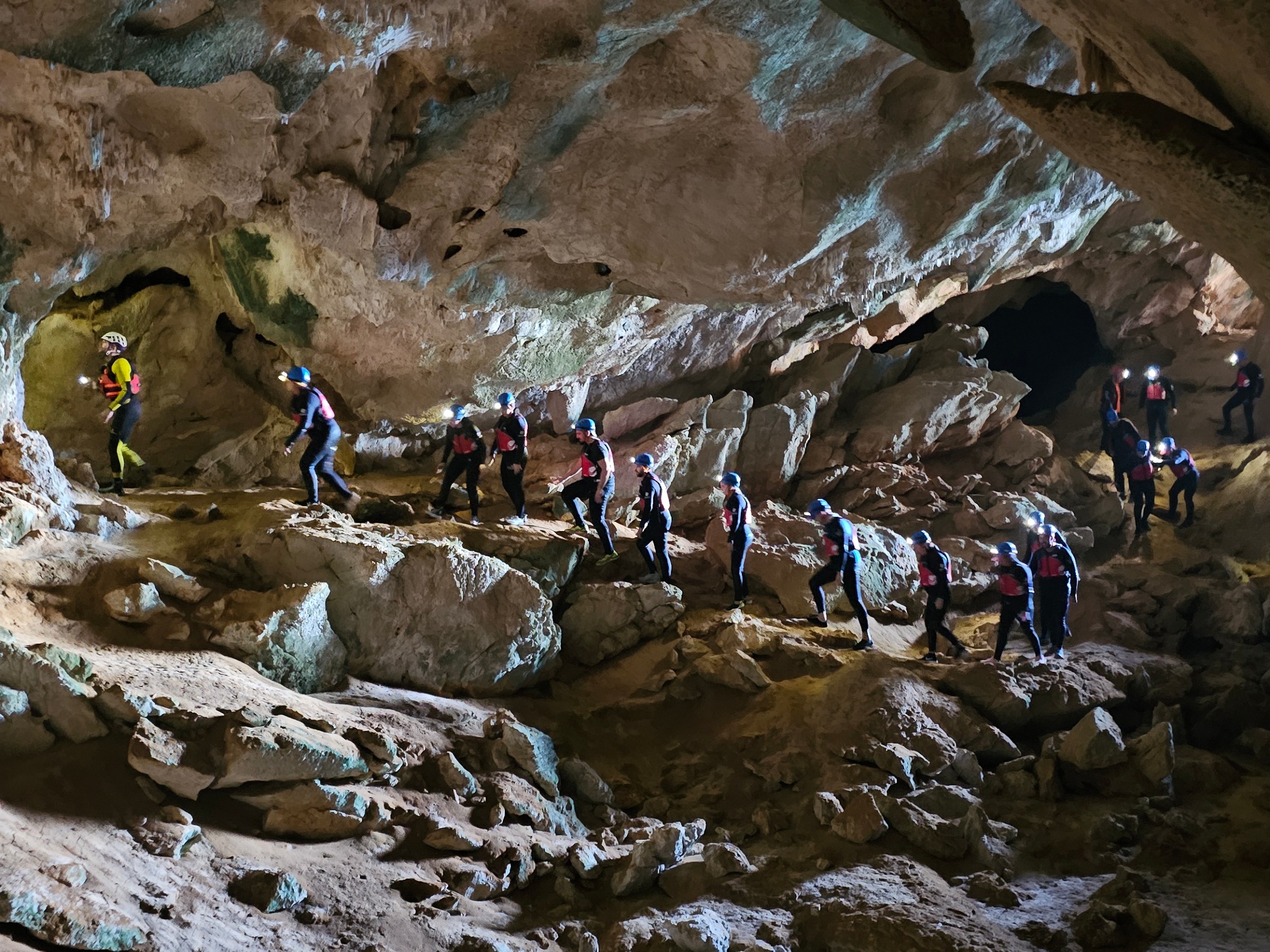 a group of people on a cave