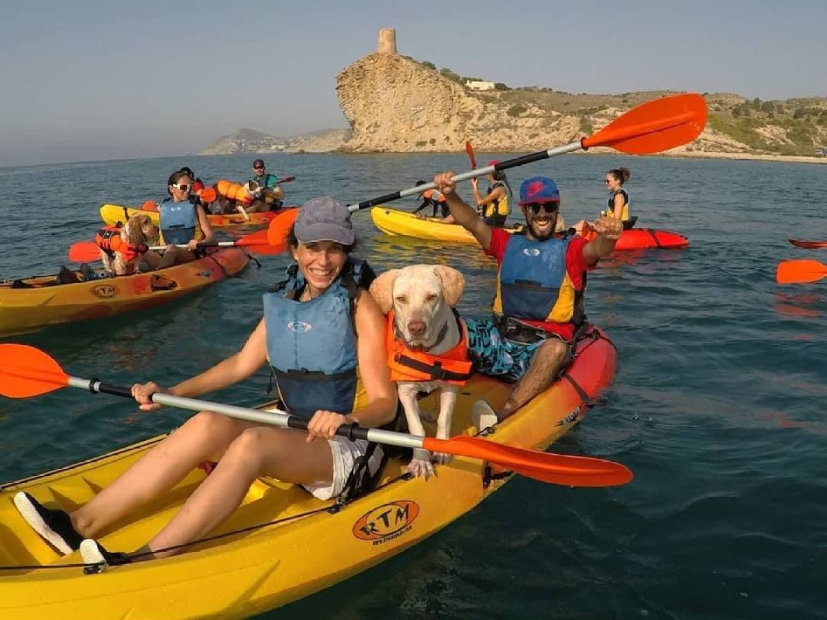 a group of people on a raft in a body of water