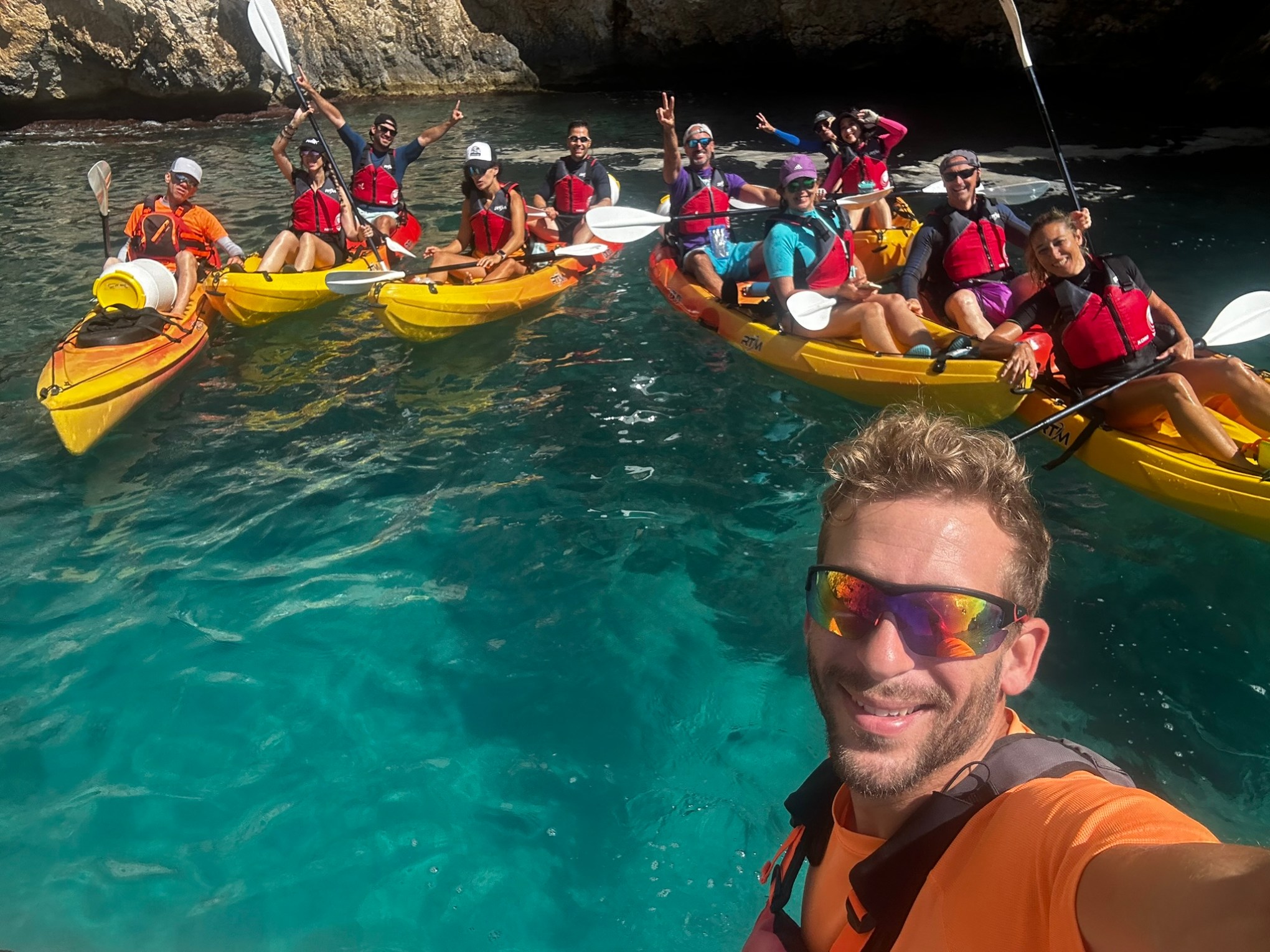 a group of people on a boat in the water