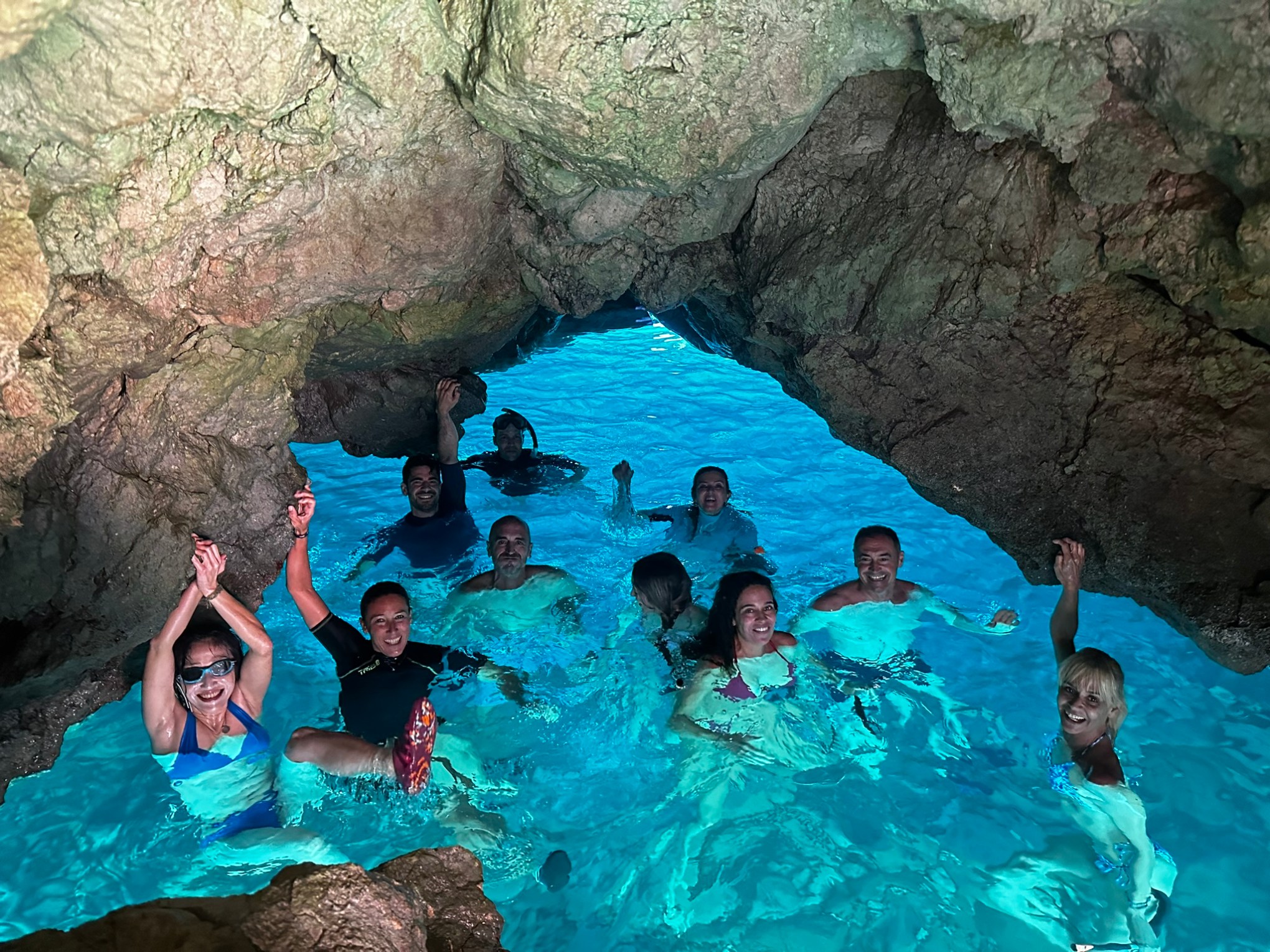 a group of people swimming in a body of water