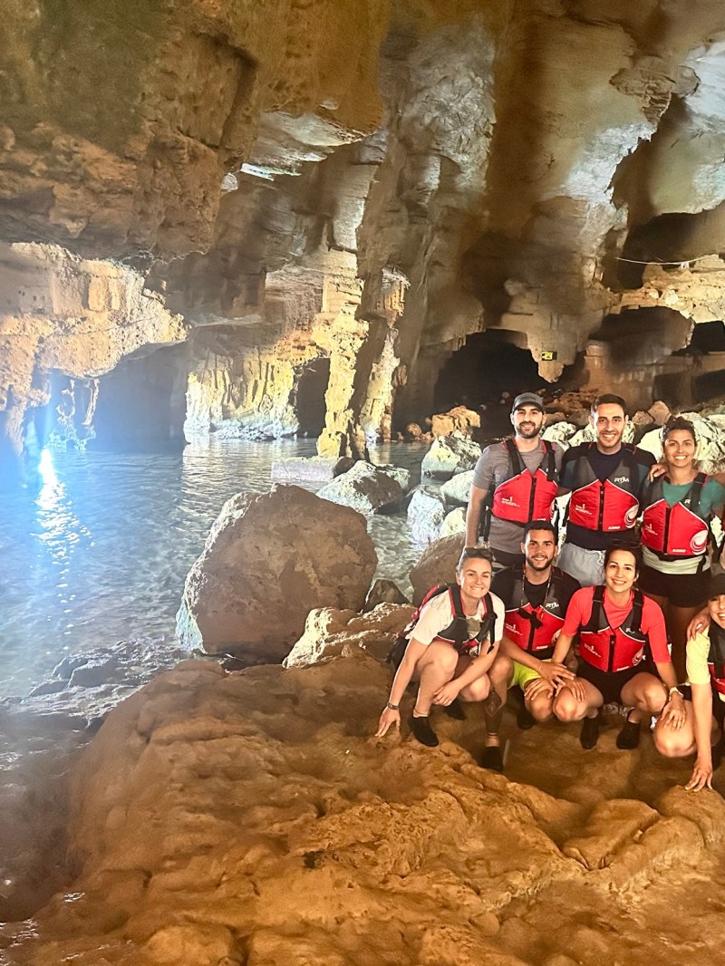 a group of people on a cave