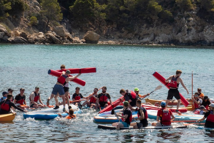a group of people on a boat in the water