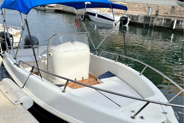 a boat is docked next to a body of water