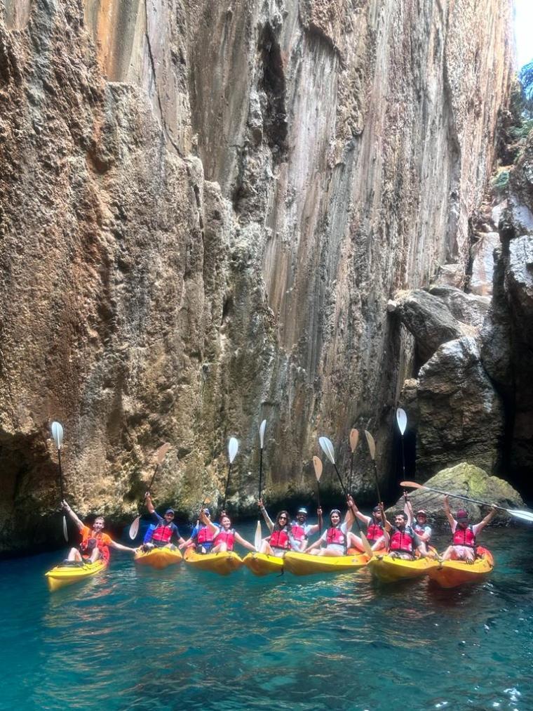 a group of people swimming in a body of water