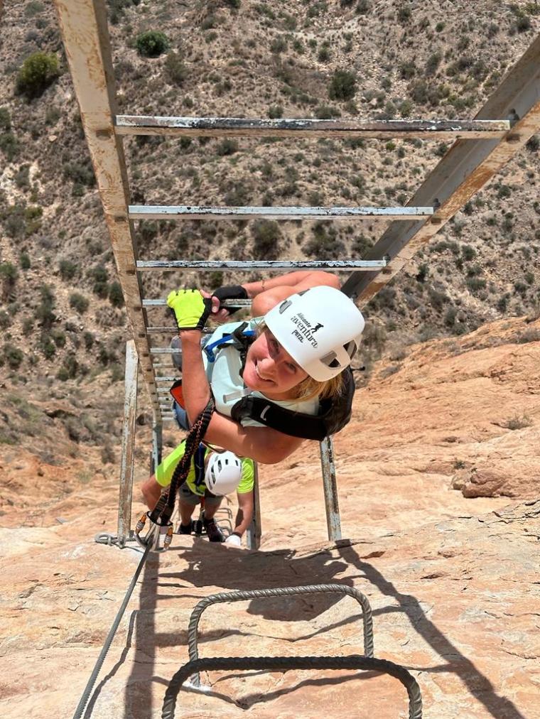 a man riding a bike down a dirt road