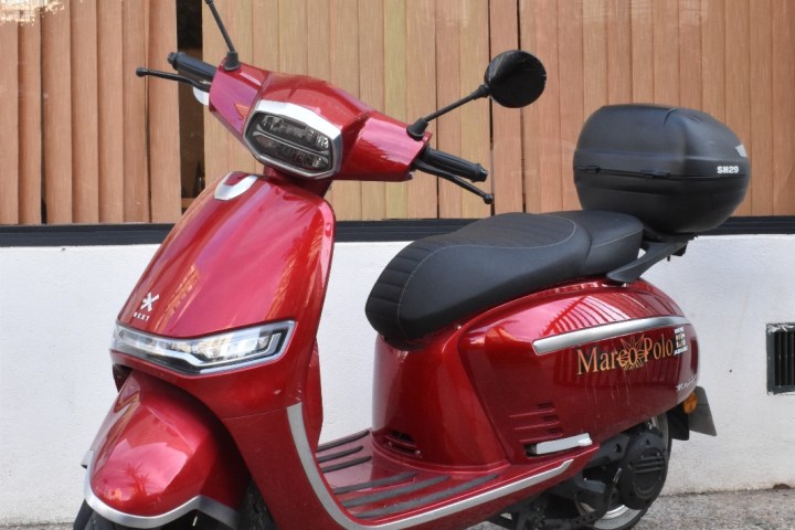 a motorcycle parked on the side of a building