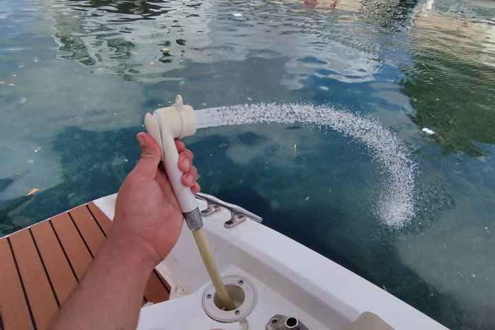a person sitting on a boat in the water