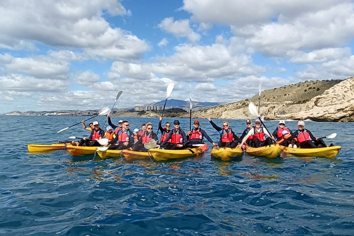 a group of people on a raft in a body of water