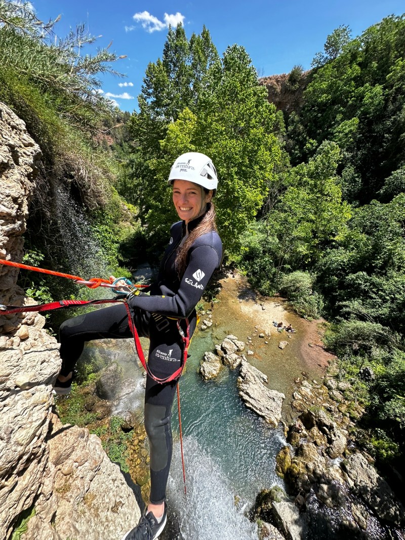 Lara Gut standing on a rock