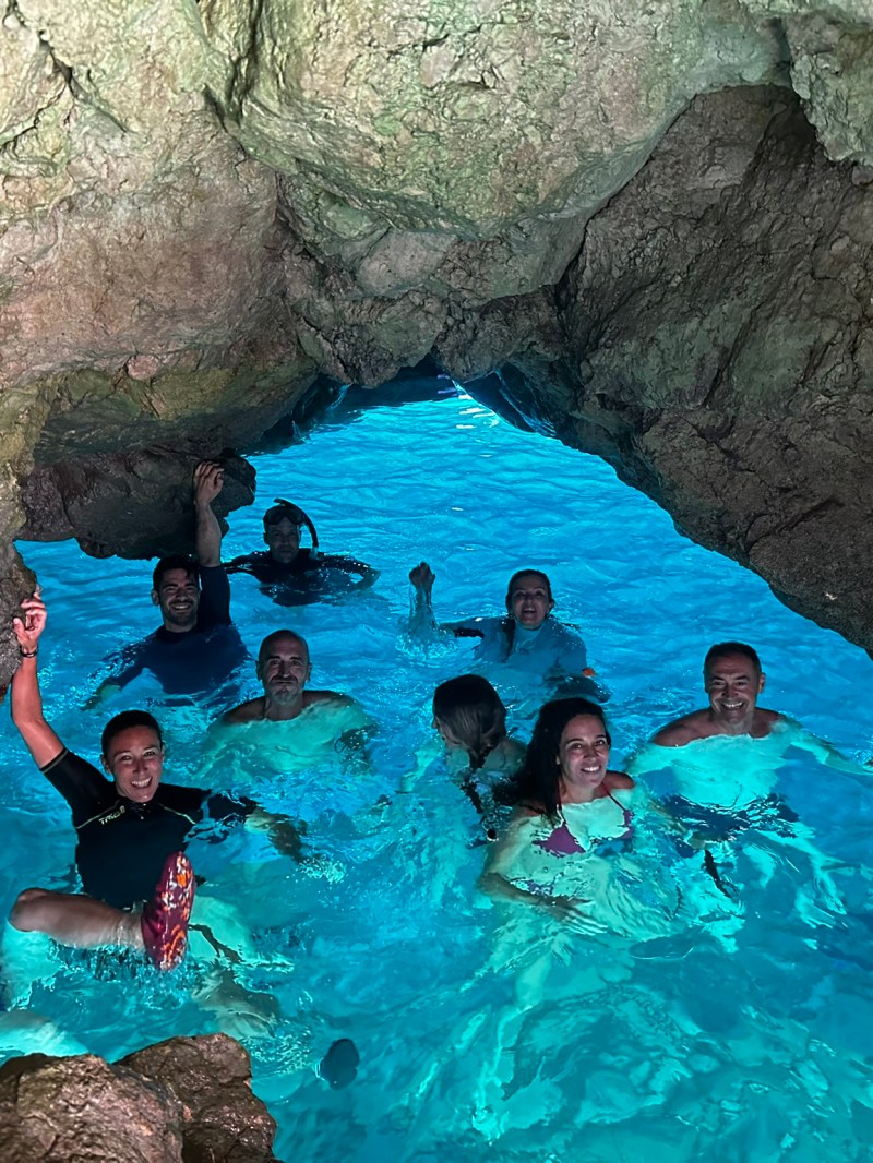 a group of people swimming in a body of water