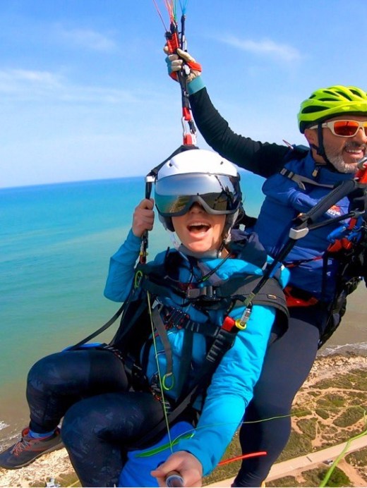 a person standing next to a body of water