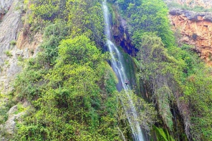 a large waterfall in a forest